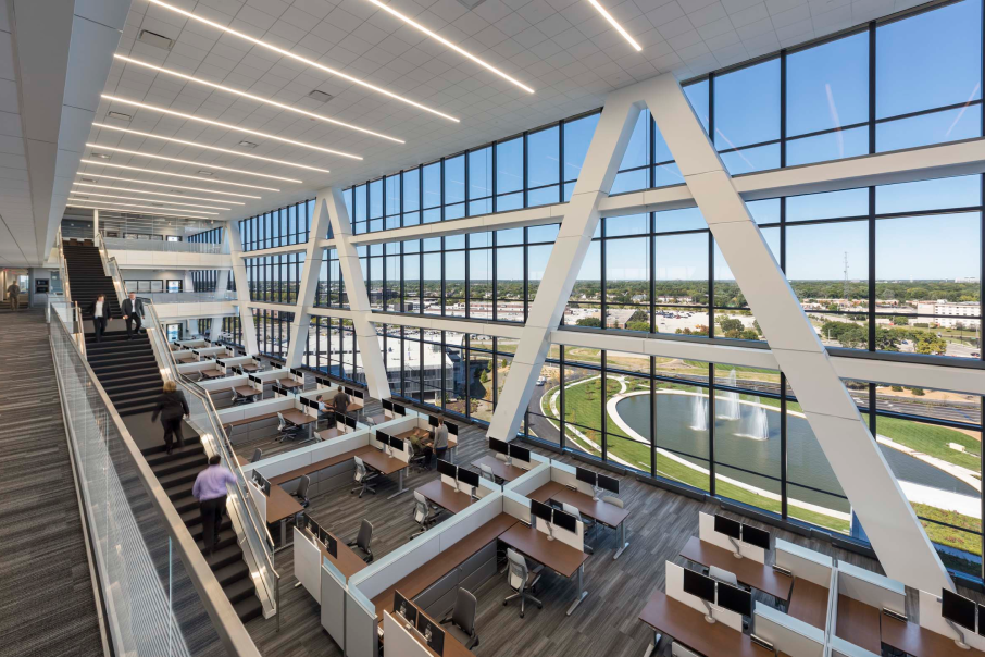 Inside Zurich American Insurance Company’s headquarters at 90 North Schaumburg, featuring an open-concept design with expansive glass walls and scenic views of the campus.