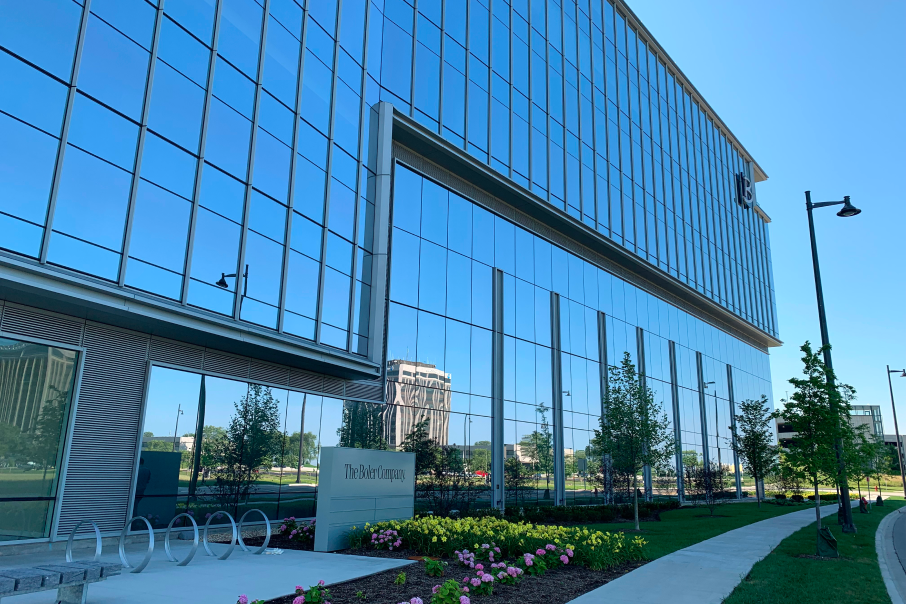 A side view of The Boler Company headquarters at 90 North Schaumburg, featuring sleek glass walls and modern architecture.