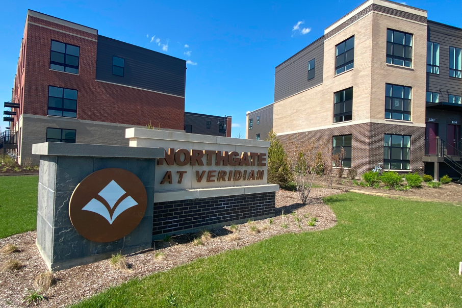 Northgate at Veridian Condos in 90 North Schaumburg, showcases modern residential design with brick accents and green spaces