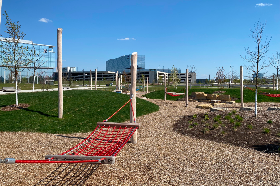 90 North Park in Schaumburg, features open green spaces, hammocks, and walking paths for relaxation and outdoor enjoyment.