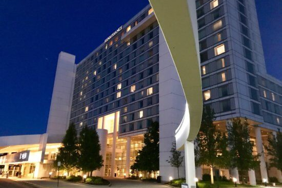 The Renaissance Hotel and Convention Center at 90 North Schaumburg, illuminated at night, offers modern elegance for business and leisure travelers.